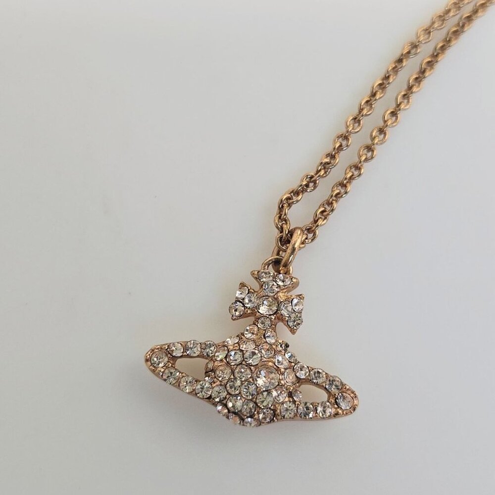 The Vivienne Westwood Grace Bas Relief pendant necklace is a rose-gold tone